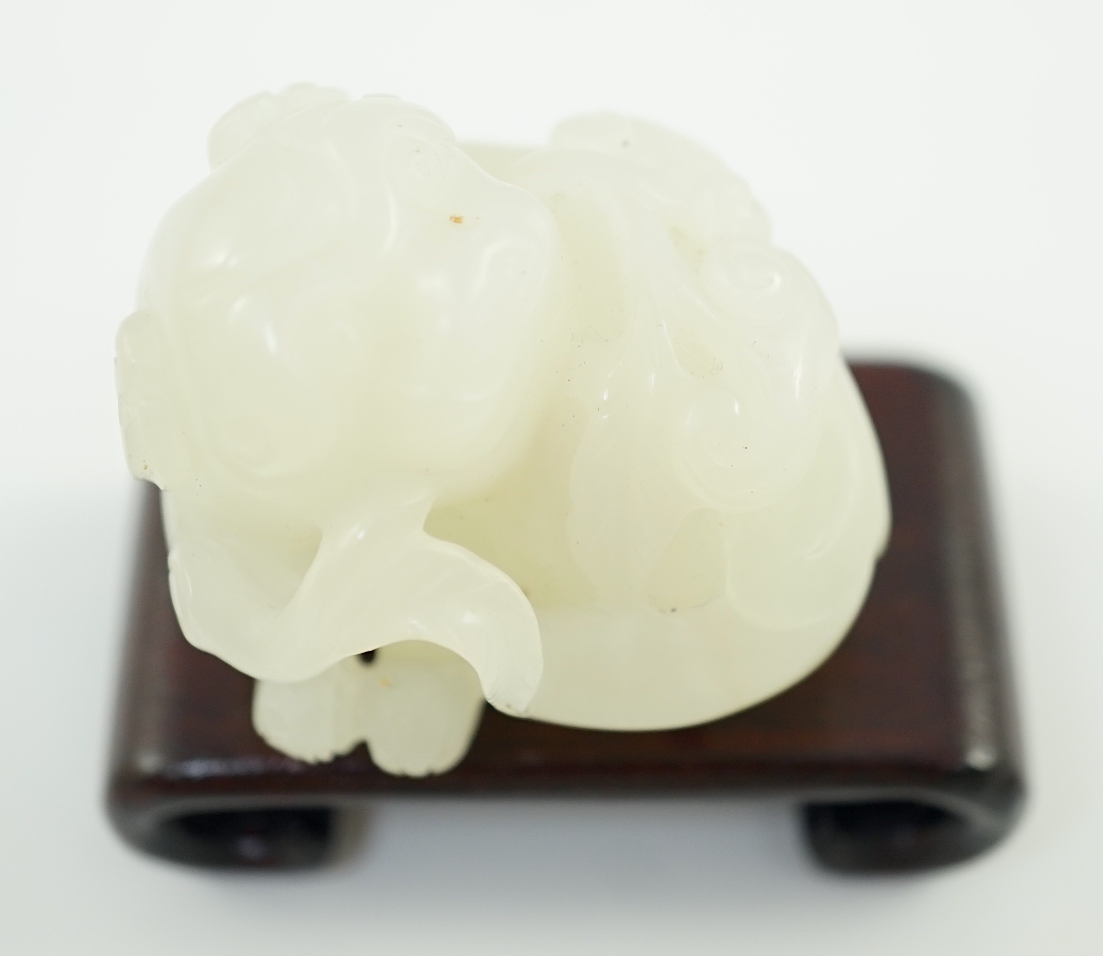 A Chinese white jade figure of a pug dog, 19th/20th century, 3.7cm long